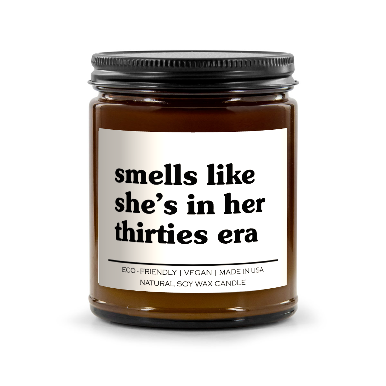 Smells Like She's In Her Thirties Era Candle in an amber vessel, showcasing its vibrant floral and fruity scents.